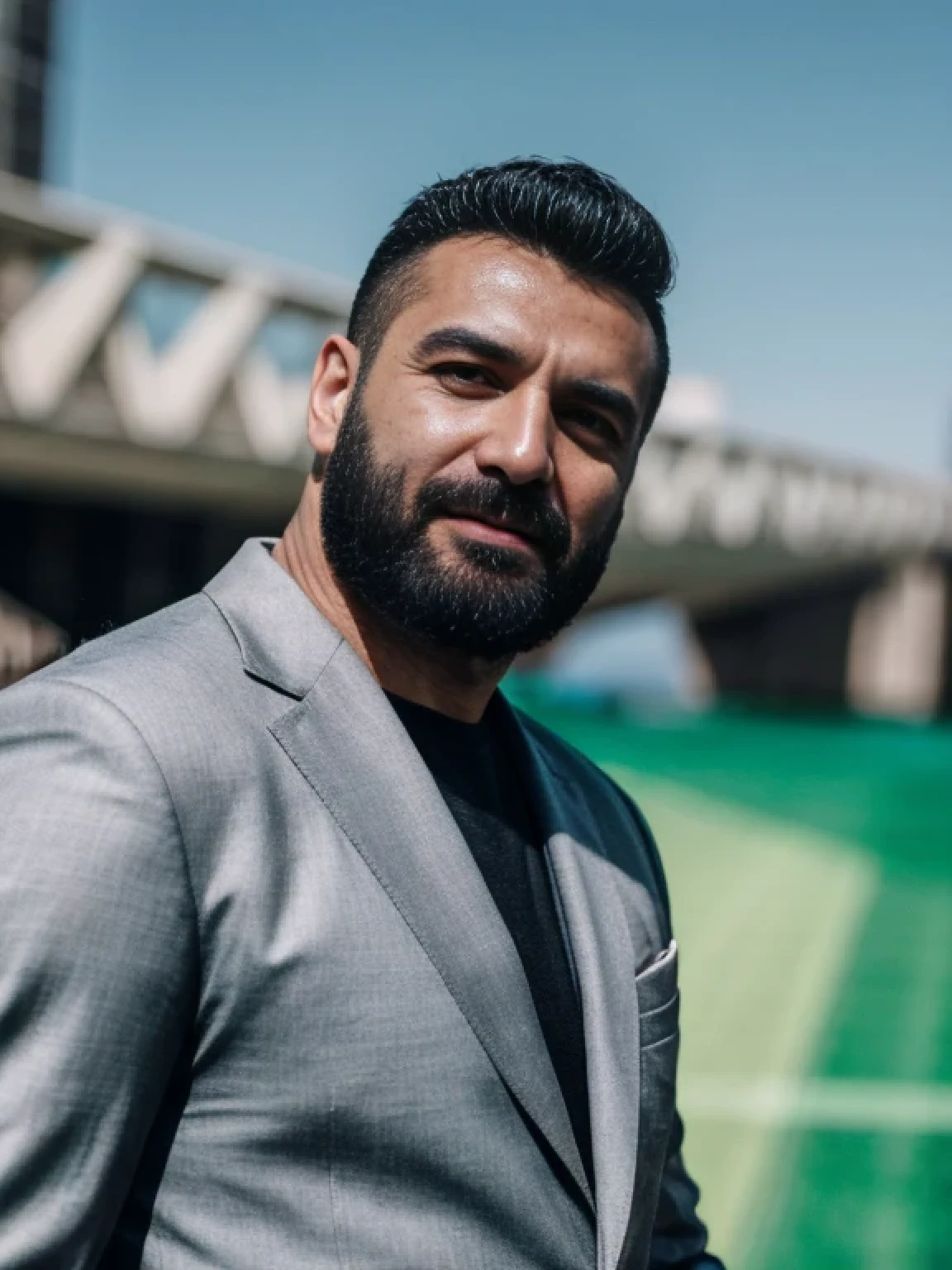 analog style, a hunky turkish man in a grey suit, handsome, stubble beard, motion blur, chromatic aberration, film grain, UHD, textured skin, award winning, highres