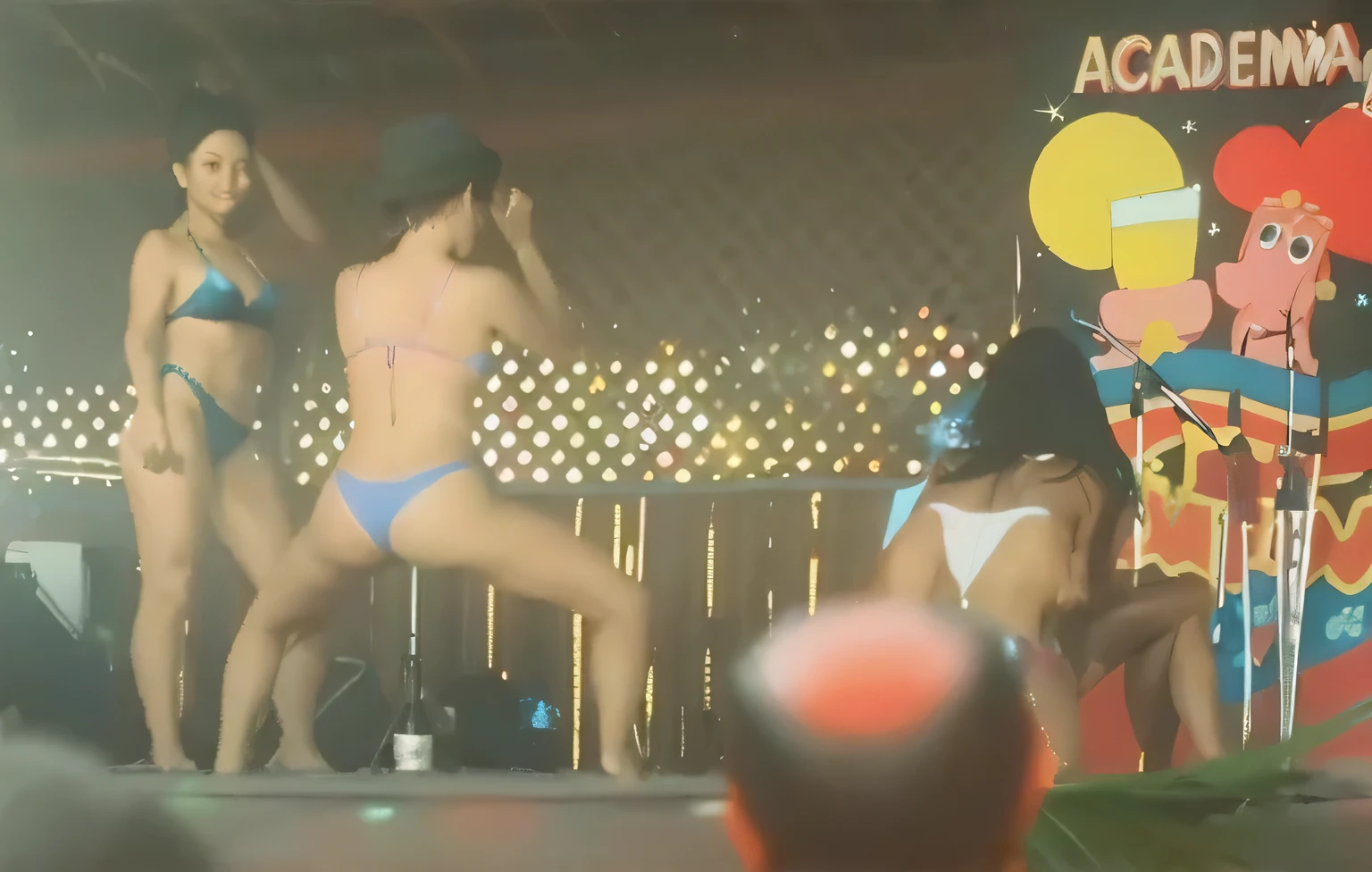 they are two women in bikinis on stage with a man in a hat, uhd foto sincera de sujo, other women dancing behind, photo from behind, gogo dancer, filmado na webcam, imagens de webcam, modelo in bikini, in bikini, dancing in the background, photo taken from behind, tiny bikini, blue bikini, in bikini, wearing spandex bikini