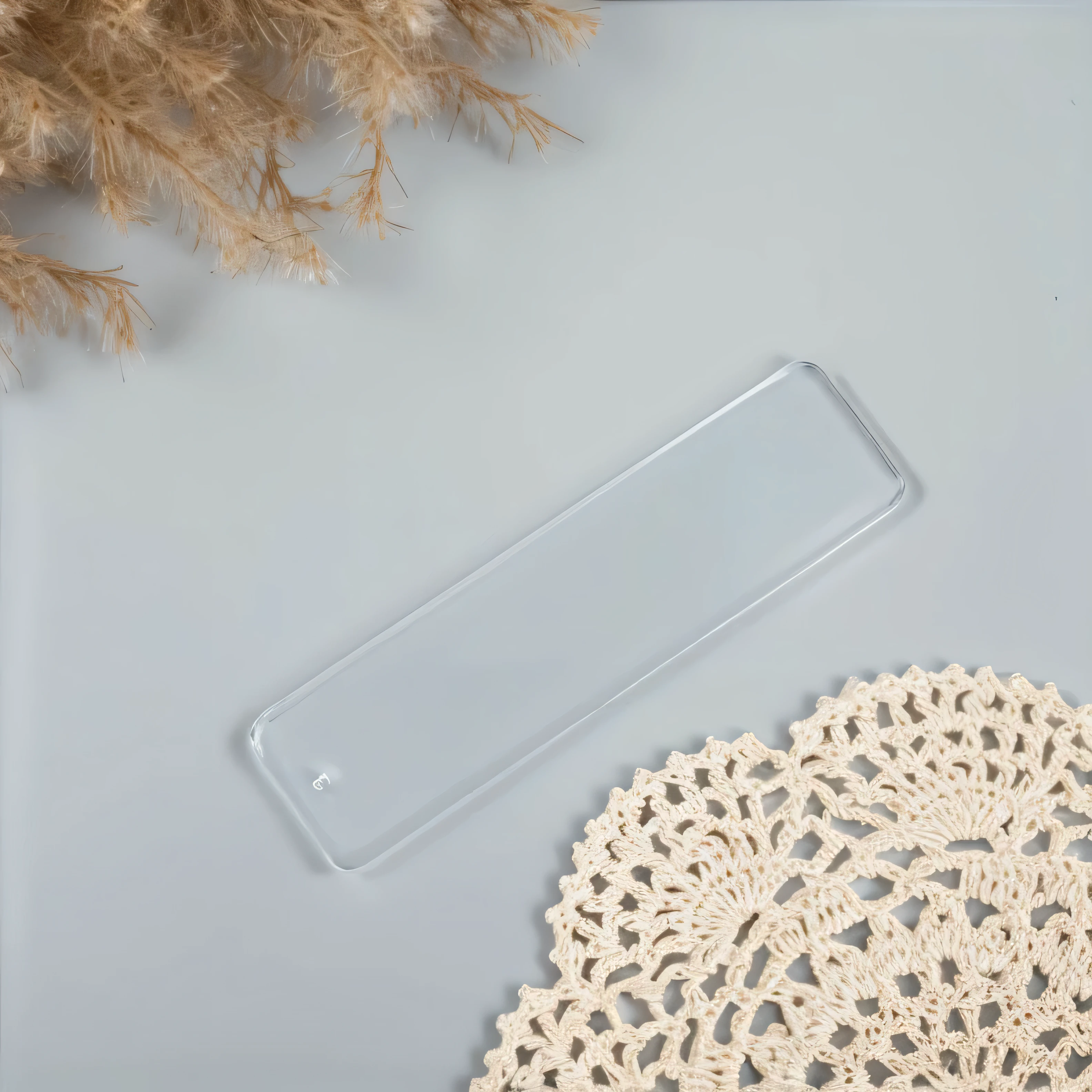 There is an acrylic bookmark with rounded rectangles on the table.,There are plants on it, Transparent acrylic,3mm, 9 0 mm, 90mm, Transparent acrylic, 80mm, 8 0 mm, Detailed product images, 8 4 mm, 84mm,