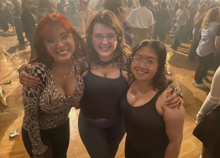 three women standing next to each other in a room full of people, non blurry, with tiny people, concert photo, not blurry, photo taken in 2 0 2 0, very grainy, very very low quality picture, profile pic, profile picture, very very low quality, by Bernie D’Andrea, photograph of three ravers, threesome, Big tits, huge tits, no clothes, sexy, cute, wide hips, thick thighs, pear-shaped body, minimal clothes, thick, bbw, chubby stomach, thick nipples, nipple piercings, large areola, hard nipples, piercing through shirt, nipples hard through shirt, chubby stomach showing, tummy spilling over the side, muffin top, the girls are sexy, short girls, only top of body, top zoom in, girl in middle behind