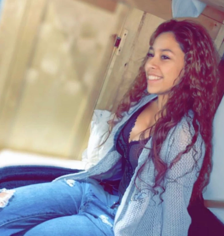 there is a woman sitting on a bed with a blue blanket, teenage vanessa morgan, alanis guillen, beautiful girl, profile image, sitting down casually, beautiful and smiling, violet myers, taken in the early 2020s, profile picture, vanessa morgan, she is about 1 6 years old, headshot profile picture, beautiful surroundings, photoshoot, beautiful gorgeous, Big tits, huge tits, no clothes, sexy, cute, wide hips, thick thighs, pear-shaped body, minimal clothes, thick, bbw, chubby stomach, thick nipples, nipple piercings, large areola, hard nipples, piercing through shirt, nipples hard through shirt, chubby stomach showing, tummy spilling over the side, muffin top, panties only, no pants, pants off, stomach too big for panties, small crop top shirt, major cleavage, nipples showing through shirt, side angle, from the side, sitting, upper body zoom