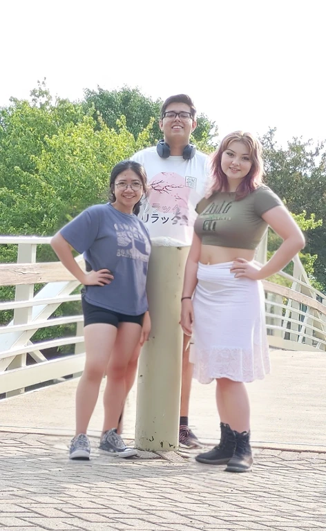 three people standing on a bridge with a woman standing next to them, standing on a bridge, on a bridge, taken in the early 2020s, vacation photo, waist high, standing near the beach, group photo, casual pose, environmental shot, on a sunny day, profile pic, photo taken in 2 0 2 0, 2 0 2 2 photo, threesome, Big tits, huge tits, no clothes, sexy, cute, wide hips, thick thighs, pear-shaped body, minimal clothes, thick, bbw, chubby stomach, thick nipples, nipple piercings, large areola, hard nipples, piercing through shirt, nipples hard through shirt, chubby stomach showing, tummy spilling over the side, muffin top, panties only, no pants, pants off, stomach too big for panties, small crop top shirt, major cleavage, nipples showing through shirt,