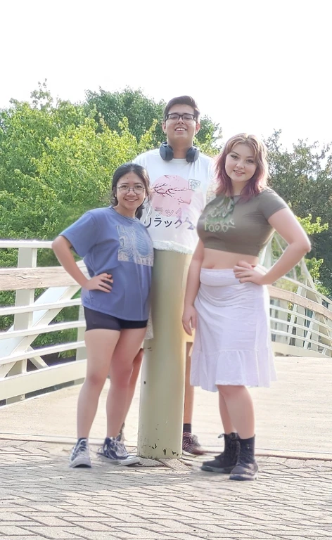 three people standing on a bridge with a woman standing next to them, standing on a bridge, on a bridge, taken in the early 2020s, vacation photo, waist high, standing near the beach, group photo, casual pose, environmental shot, on a sunny day, profile pic, photo taken in 2 0 2 0, 2 0 2 2 photo, threesome, Big tits, huge tits, no clothes, sexy, cute, wide hips, thick thighs, pear-shaped body, minimal clothes, thick, bbw, chubby stomach, thick nipples, nipple piercings, large areola, hard nipples, piercing through shirt, nipples hard through shirt, chubby stomach showing, tummy spilling over the side, muffin top, panties only, no pants, pants off, stomach too big for panties, small crop top shirt, major cleavage, nipples showing through shirt, 