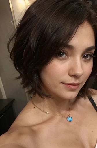 Selfie girl with short, dark brown, shoulder-length hair, necklace with a blue heart surrounded by diamond inserts around the neck