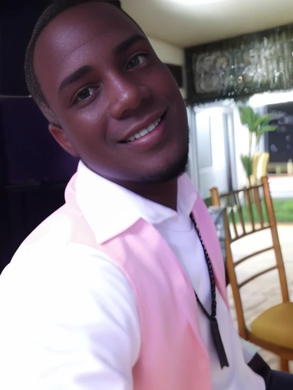 A handsome young man smiling wide to the right, sitting taking a selfie in a white shirt and with an orange shirt and a black thread around his neck with a map of the African continent, with a little beard on his chin, sparkles in his right eyes and on the tip of his nose, his hair cut in two ways and well drawn, proximo da culona do djs, with a party hall as a backdrop