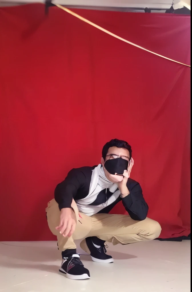 arafed man in a black shirt and tan pants crouching down, photoshoot, modeling shoot, in front of white back drop, in red background, full body photoshoot, very very low quality picture, solo photoshoot, cinematic shoot, photo from a promo shoot, photo shoot, portrait photo of a backdrop, studio shoot, full body shoot, front profile!!!!, wearing mask