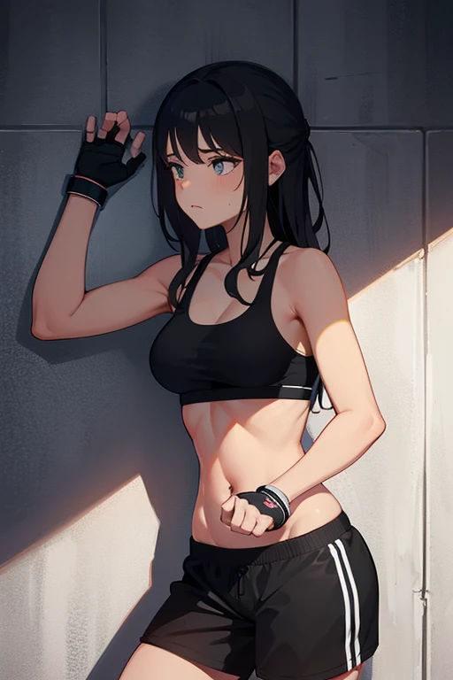 girl in black sports bra with hands chained to a wall