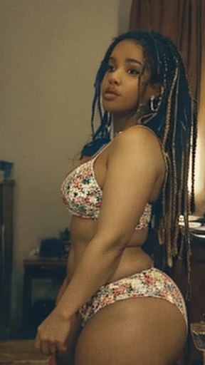 Analog image, neutral density,Highly detailed image ,thick voluptuous Dominican woman, viewed from side,with micro dreadlocks, highly detailed skin,skin imperfections, skin pores visible,wearing a tight panties and sports bra ,in a dim lit room , highly detailed clothing 