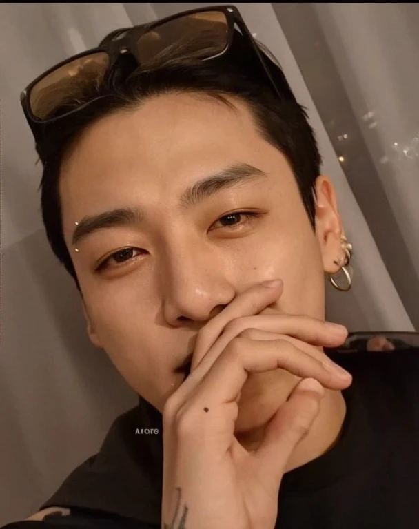 a close-up of a person with a tattoo on their arm, jeon jungkook, kook jung, taken in early 2024, Jungkook, jeon jungkook hyung, brilhante da chuva, 27 anos de idade, adorable and pale korean face, 28 anos de idade, 29 anos, inspirado em Jeon Jung-Kook, jungkook, jungkook jeon