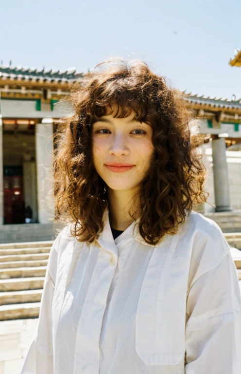 Willow Ryder, masterpiece, best quality, 1girl, smile, lips, brown eyes, brown (curly|messy) hair, closed mouth, looking at viewer, short hair, background: standing infront of a temple solo, upper body, wearing religious attire, 