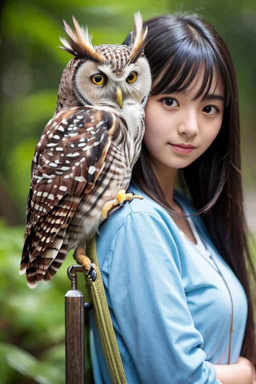 Blakiston&#39;s fish owl perches on the shoulder of an 18-year-old Japanese woman