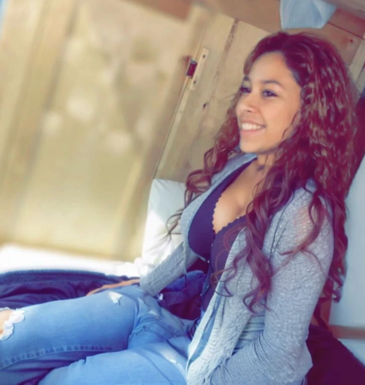 there is a woman sitting on a bed with a blue blanket, teenage vanessa morgan, alanis guillen, beautiful girl, profile image, sitting down casually, beautiful and smiling, violet myers, taken in the early 2020s, profile picture, vanessa morgan, she is about 1 6 years old, headshot profile picture, beautiful surroundings, photoshoot, beautiful gorgeous, Big tits, huge tits, no clothes, sexy, cute, wide hips, thick thighs, pear-shaped body, minimal clothes, thick, bbw, chubby stomach, thick nipples, nipple piercings, large areola, hard nipples, piercing through shirt, nipples hard through shirt, chubby stomach showing, tummy spilling over the side, muffin top, panties only, no pants, pants off, stomach too big for panties, small crop top shirt, major cleavage, nipples showing through shirt, side angle, from the side, sitting, upper body zoom