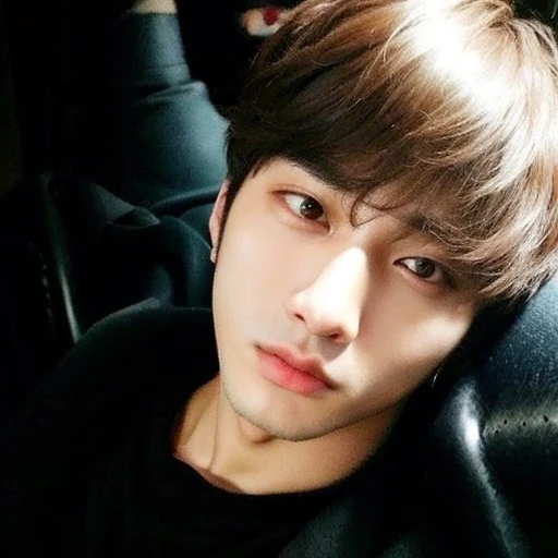 a close-up of a person lying on a sofa, jungkook de cabelo preto, Jungkook, adorable and pale korean face, Jung Jaehyun, hyung tae, accurate Jungkook face, Jinyoung Shin, Kim Doyoung, your eyes seem wise, your eyes are brown and bright, Jimin\the right eyelid is swollen, Hong junho hyung, pintar ulzzang jungkook bts