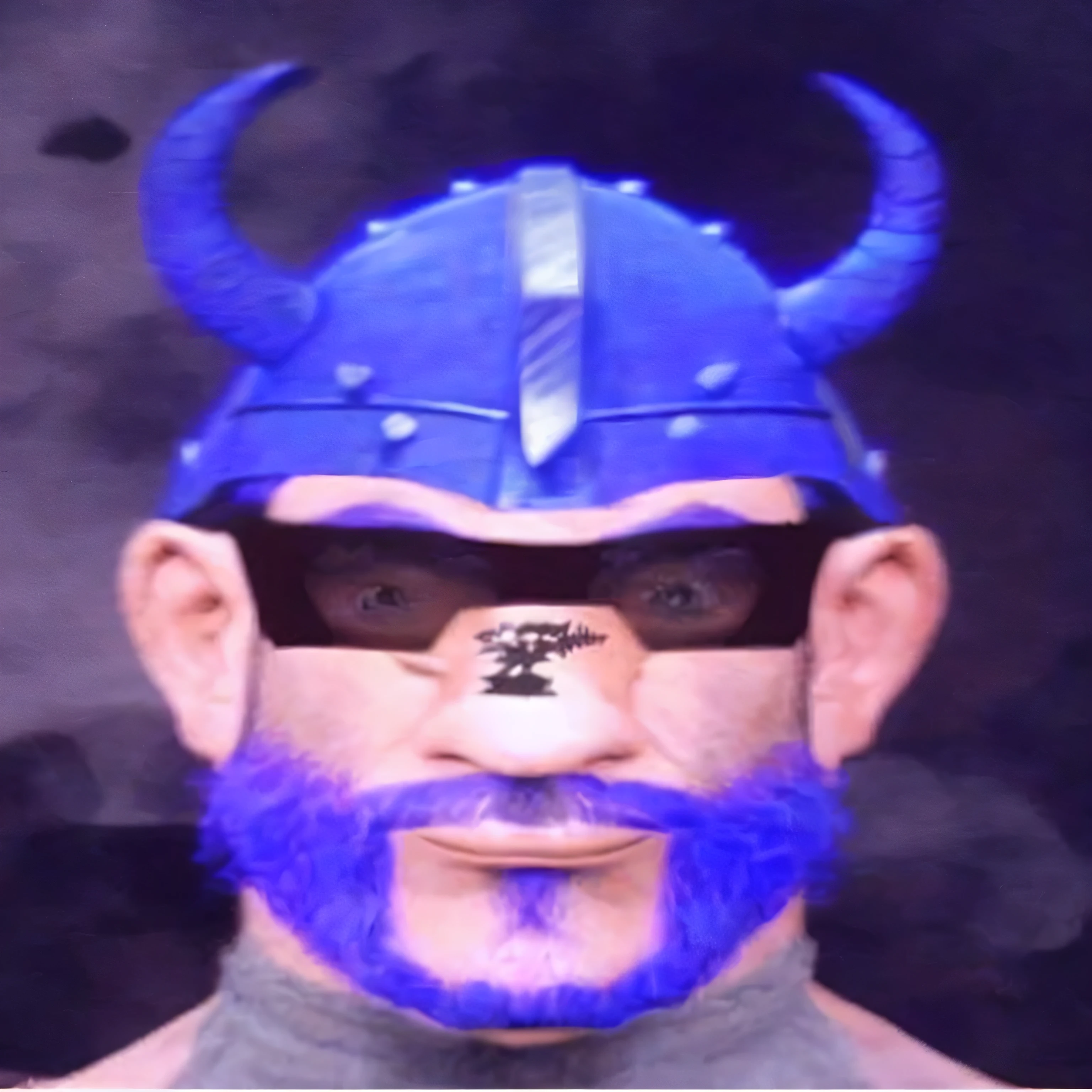 A man with a blue beard, blue viking helmet, a question mark on his nose, a grey t-shirt, weird eyes, and an overbite.