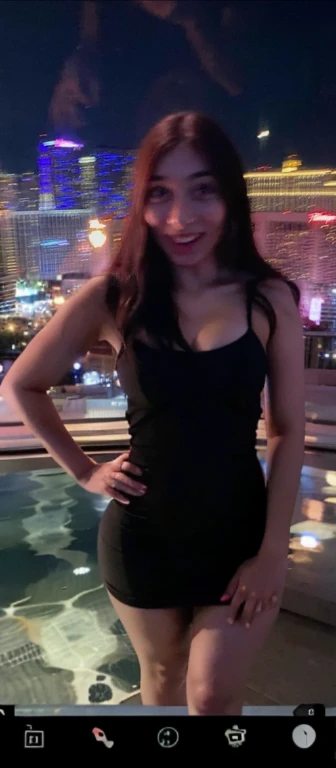arafed woman standing on a balcony, 3 0 years old woman, 30 years old woman, around 20 yo, in las vegas, standing in a dimly lit room, at future neon light rooftop, 1 , wearing black, 2 3 ye8 years old, Bie tits, no clexy, cute, wides, thick thighs, p-shaped body, minimal clothes, thick, extra wide hips, bbw, wide girl, giant tits, tits busting , nipple showing,  spig out side, sideboob, faing, minimal clothes, thick, thicc, upper body zoom, showing waist, hard nipples, see through top