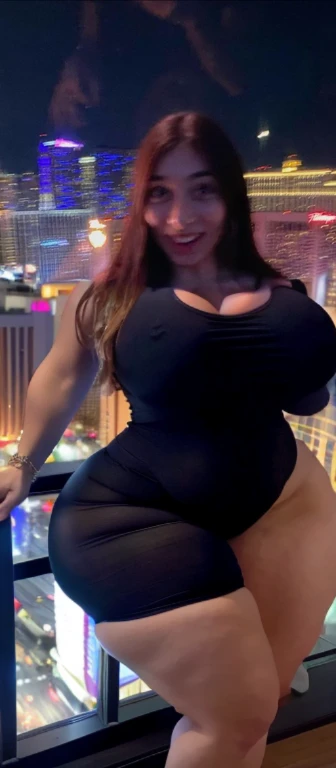 arafed woman standing on a balcony, 3 0 years old woman, 30 years old woman, around 20 yo, in las vegas, standing in a dimly lit room, at future neon light rooftop, 1 8 yo, wearing black, 2 s old, 2 8 year Big tits, huge tits, no clothes, sexy, cute, wide hips, thick thighs, pear-shaped body, minimal clothes, thick, extra wide hips, bbw, wide girl, giant tits, tits busting out, nipple showing, spilling out the side, sideboob, fat showing, minimal clothes, thick, thicc, upper body zoom, showing waist, hard nipples, see through top, down to knees only
