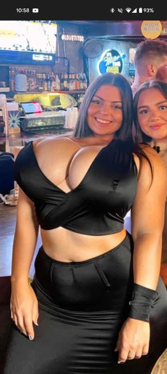 there are two women that are posing for a picture together, taken in the early 2020s, non blurry, low quality photo, very silly looking, wearing shiny breastplate, mid 2 0's female, wearing a low cut tanktop, two girls, not blurry, posing together in bra, 21 years old, wearing a cropped black tank top, big tits, huge tits, no clothes, sexy, cute, wide hips, thick thighs, pear-shaped body, minimal clothes, thick, extra wide hips, bbw, wide girl, giant tits, tits busting out, nipple showing, spilling out the side, sideboob, fat showing, minimal clothes, thick, thicc, upper body zoom, showing waist, hard nipples, see through top