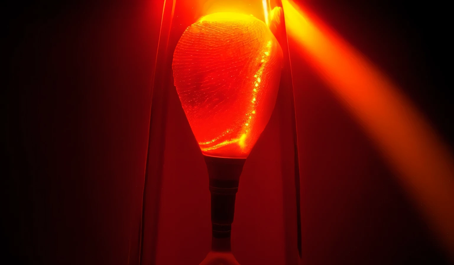 a close up of a lava light bulb with a black base, lava light bulb, lava light bulbs, orange and red lighting, brilho vermelho e laranja, luz vermelha e amarela, glowing liquid, Luz do humor, red orange lighting, orange light bulb, de um enorme bong de vidro vermelho, glowing light bulbs, light bulb ( ( ( fish tank ) ) ) ), Fluido vermelho, red liquid