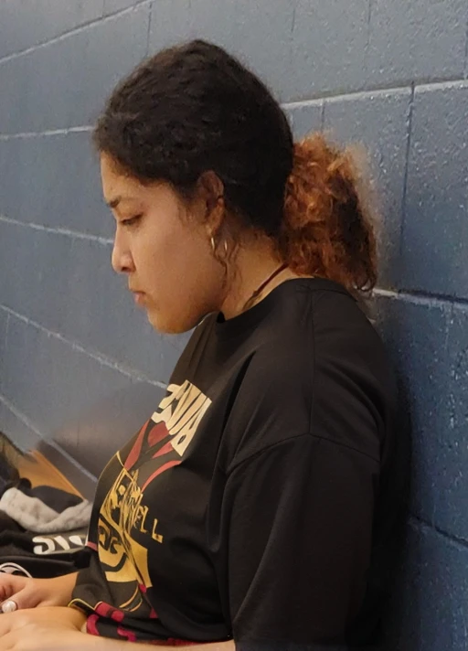 there is a woman sitting on a bench using a cell phone, resting after a hard fight, deep in thought, profile shot, candid shot, side profile shot, heavy grainy picture, lost in thought, low quality grainy, pensive, grainy low quality, left profile, looking sad, side profile portrait, looking distracted, student, movie still of a tired, latina, Big tits, huge tits, no clothes, sexy, cute, minimal clothes, thick, thick nipples, nipple piercings, large areola, hard nipples, piercing through shirt, nipples hard through shirt, major cleavage, nipples showing through shirt, giant tits, showing off tits, looking left, facing left, sideboob, side profile