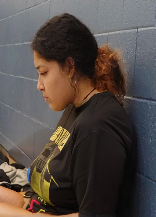 there is a woman sitting on a bench using a cell phone, resting after a hard fight, deep in thought, profile shot, candid shot, side profile shot, heavy grainy picture, lost in thought, low quality grainy, pensive, grainy low quality, left profile, looking sad, side profile portrait, looking distracted, student, movie still of a tired, latina, Big tits, huge tits, no clothes, sexy, cute, minimal clothes, thick, thick nipples, nipple piercings, large areola, hard nipples, piercing through shirt, nipples hard through shirt, major cleavage, nipples showing through shirt, giant tits, showing off tits, looking left, facing left, sideboob, side profile