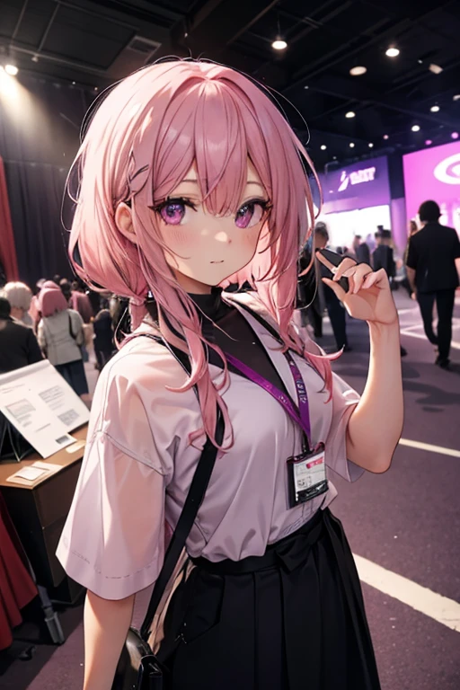 A pink haired woman with violet eyes is posing at a convention
