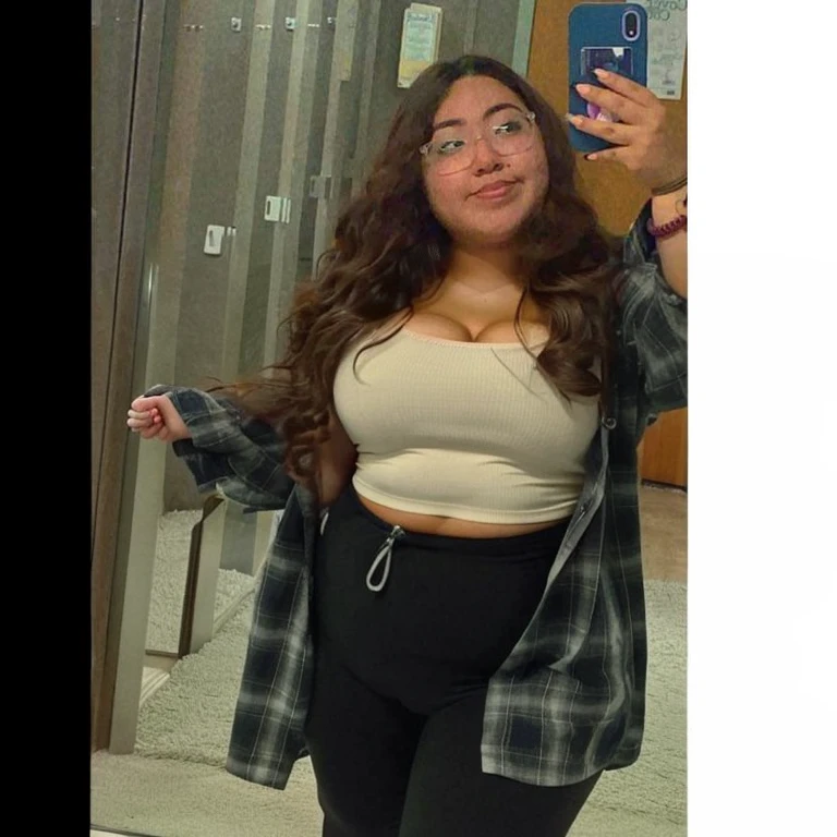 there is a woman taking a selfie in a mirror, she has a jiggly fat round belly, thicc, middle body shot, outfit photo, her belly button is exposed, full body picture, 18 years old, physical : tinyest midriff ever, her belly is fat and round, casual pose, wearing a cute top, fit pic, latina, Big tits, huge tits, no clothes, sexy, cute, wide hips, thick thighs, pear-shaped body, minimal clothes, thick, bbw, chubby stomach, thick nipples, nipple piercings, large areola, hard nipples, piercing through shirt, nipples hard through shirt, chubby stomach showing, tummy spilling over the side, muffin top, panties only, no pants, pants off, stomach too big for panties, small crop top shirt, major cleavage, nipples showing through shirt, very short crop top with fat stomach showing, extremely wide hips, thick hips, hips wide with fat stomach, upper body zoom