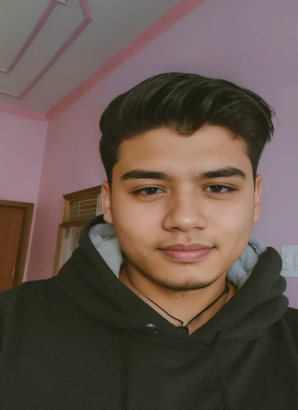 there is a man with a black hoodie and a black necklace, around 1 9 years old, 18 years old, with accurate face, without beard, 1 6 years old, ayan nag, good looking face, facebook profile picture, 2 2 years old, harsh good looking face, handsome face, 21 years old, 1 9 year old, clean shaven face