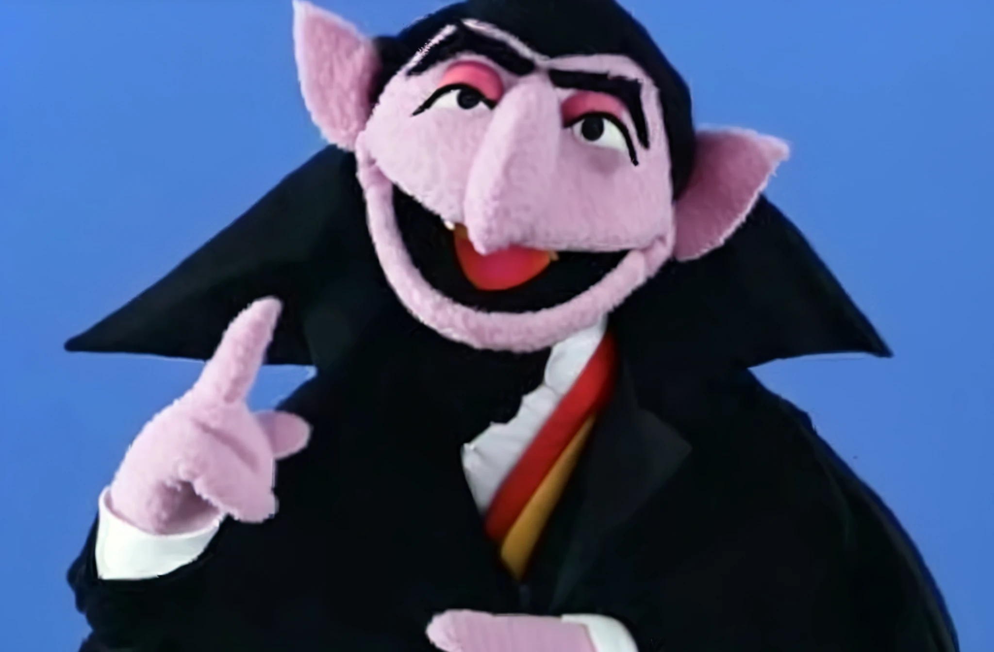 un primer plano de una persona vestida con un disfraz apuntando a algo, lorde. bean depicted as a Muppet, Count Dracula, Muppet, as a Muppet, como personaje de plastilina, gmunk, el vampiro, gonzo, Sonrisa de villano malvado, saul goodman as a Muppet, Rasputin as a Grubhub character, kafkiano, Muppet show, tono
