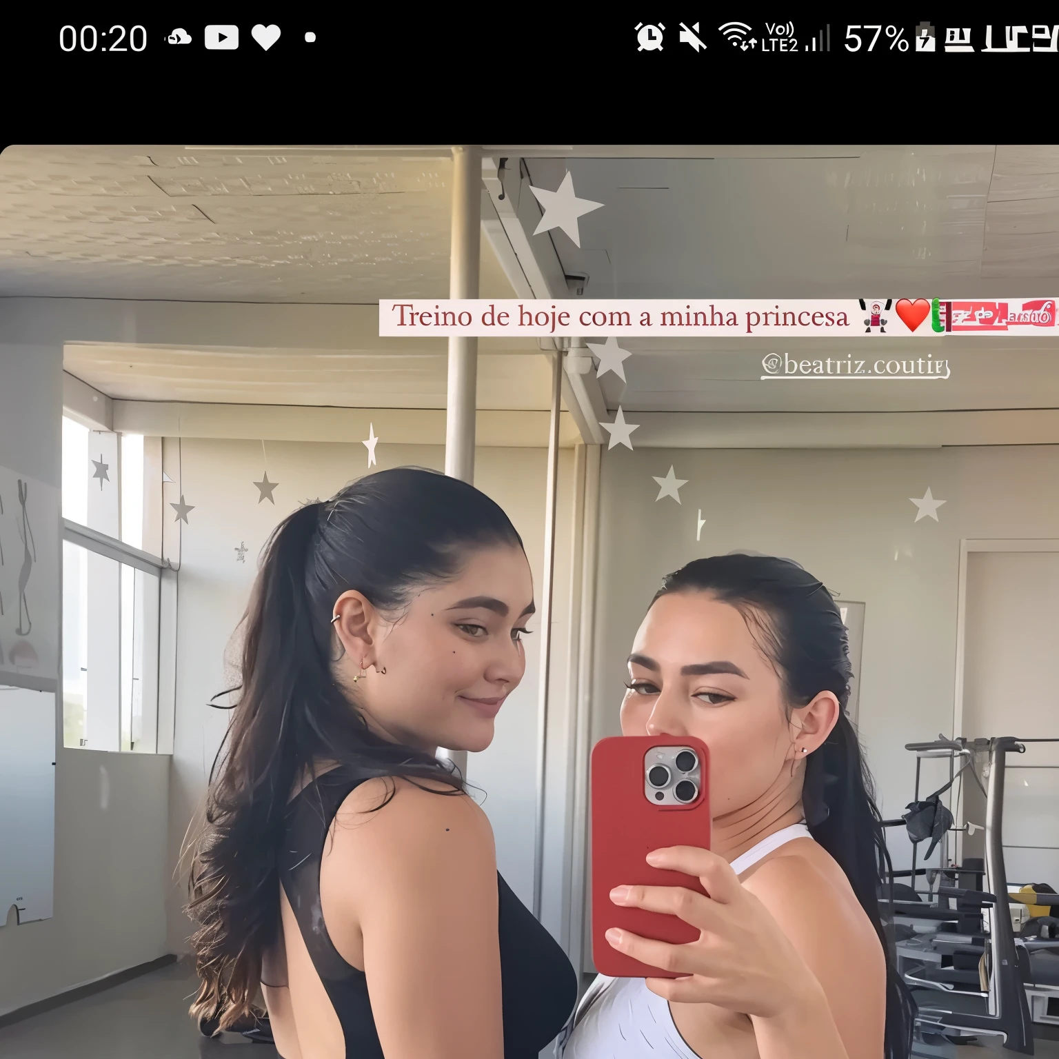 two women in tight pants taking a selfie take off their workout clothes and put them in a room