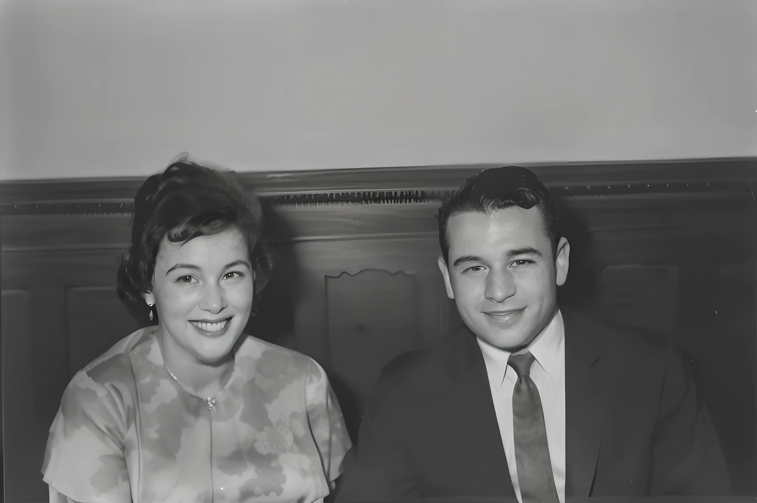 arafed black and white photo of a man and woman sitting at a table, taken in the early 1960s, 1950s photograph, photo 1960, early black and white photo, smile 1950s, archived photograph, portrait of two people, an old balck and white photo