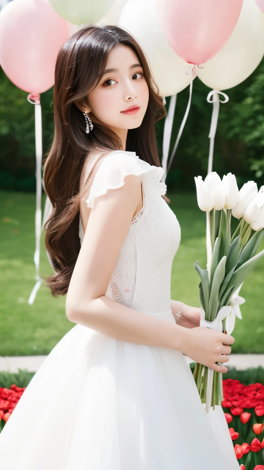 a girl is wearing beautiful long-armed white dress and holding a bunch of tulips. She is standing in front of many heart-shape white balloons.