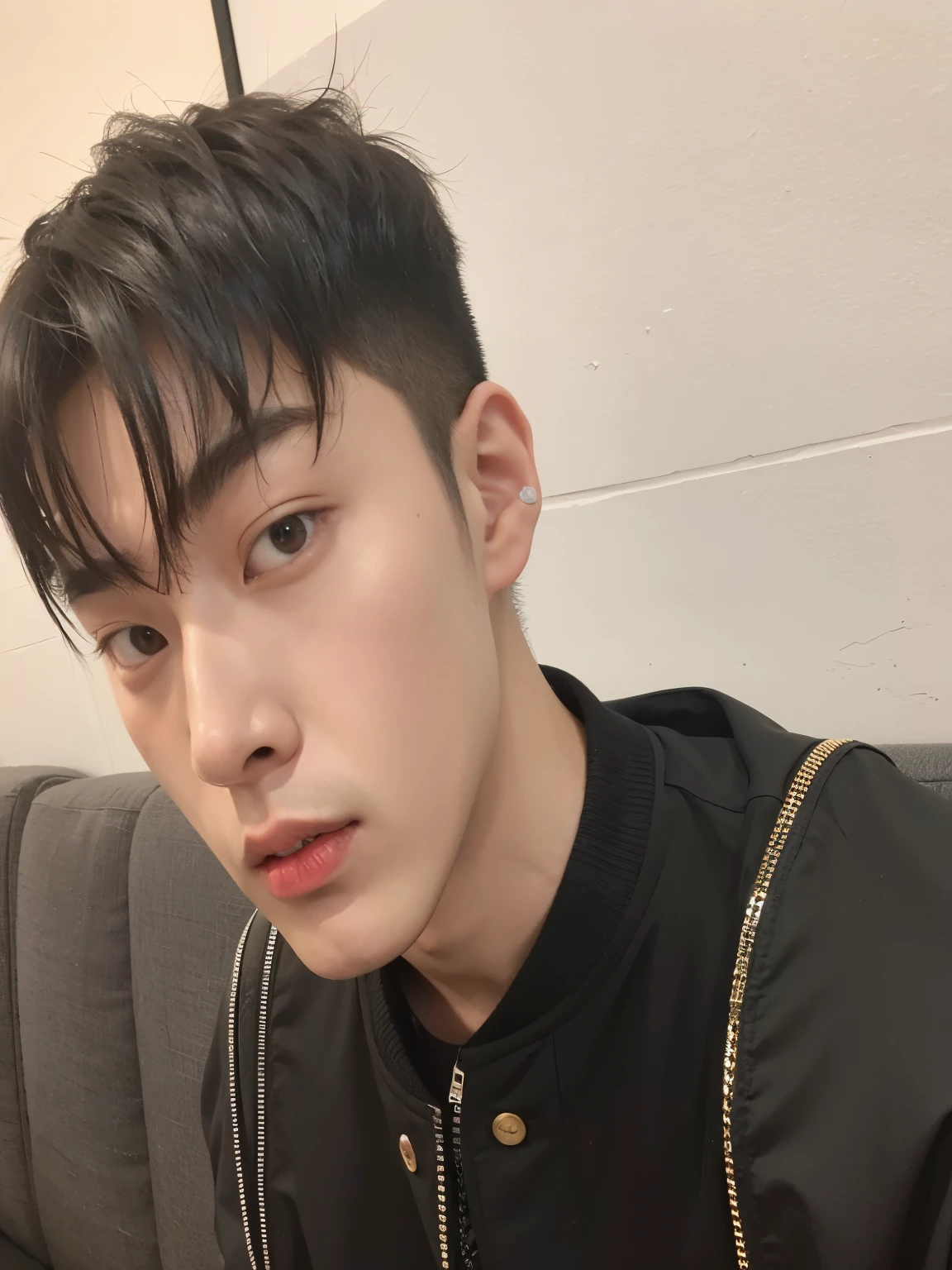 there is a man in a black jacket sitting on a sofa, cai xukun, hyung tae, hong junio hyung, Jinyoung Shin, hsiao-ron, yanjun chengt, kim doyoung, TaeJune Kim, xisionwu, hyung tae kim, foto de perfil en la cabeza, chen xintong, handsome japanese demon boy
