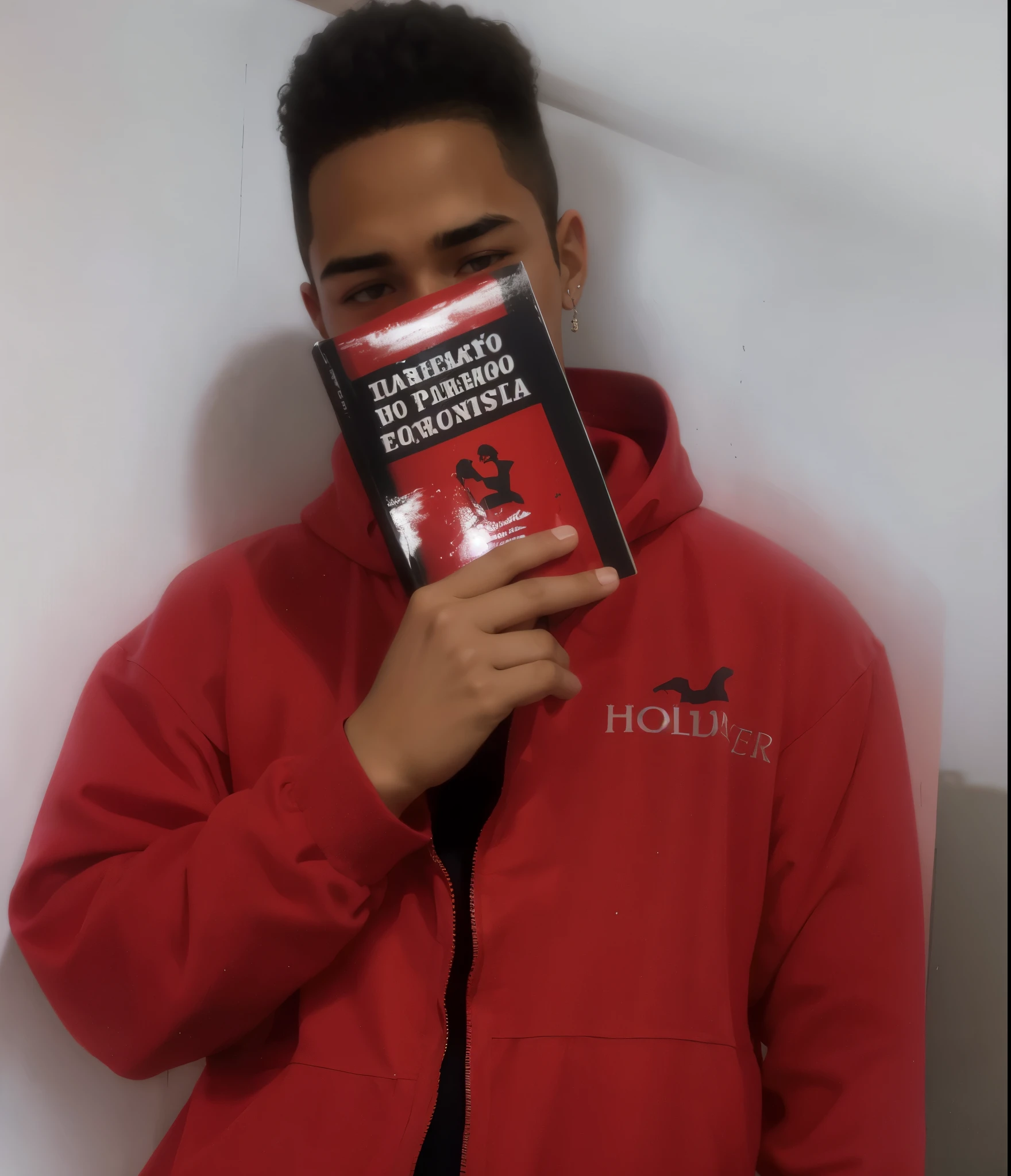 18-year-old man with red clothes from Pará and a book covering half his face