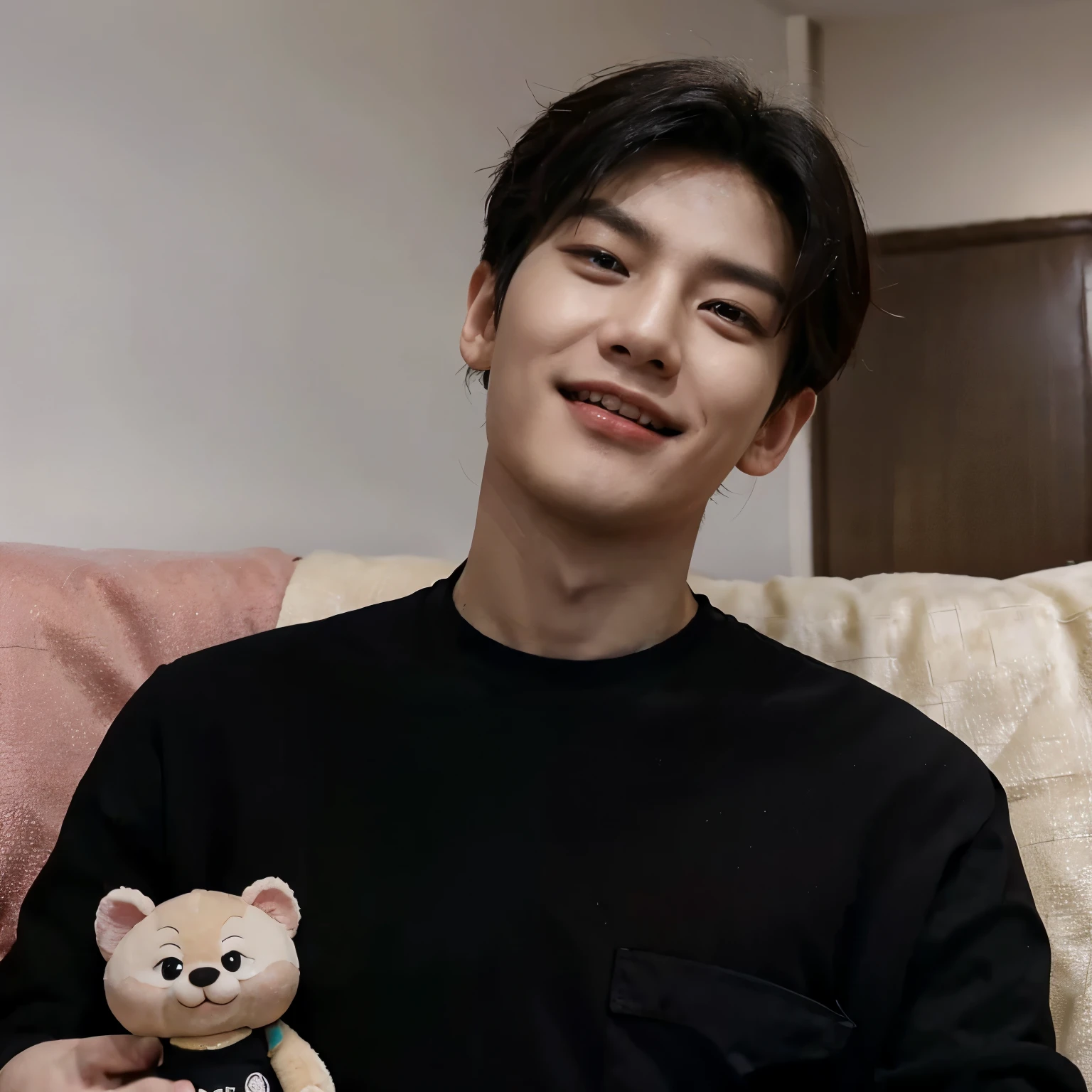 A Korean man. With a masculine and beautiful and good-looking face, medium nose, small lips, angle of the jaw, droopy and black eyes. Black hair that is styled upwards. Muscular and masculine body, tall. Black t-shirt, home comfort pants.* He is lying on the couch and laughing , He is holding a doll in the shape of a strawberry in his hands*He is wearing a suit and is taking a picture of himself