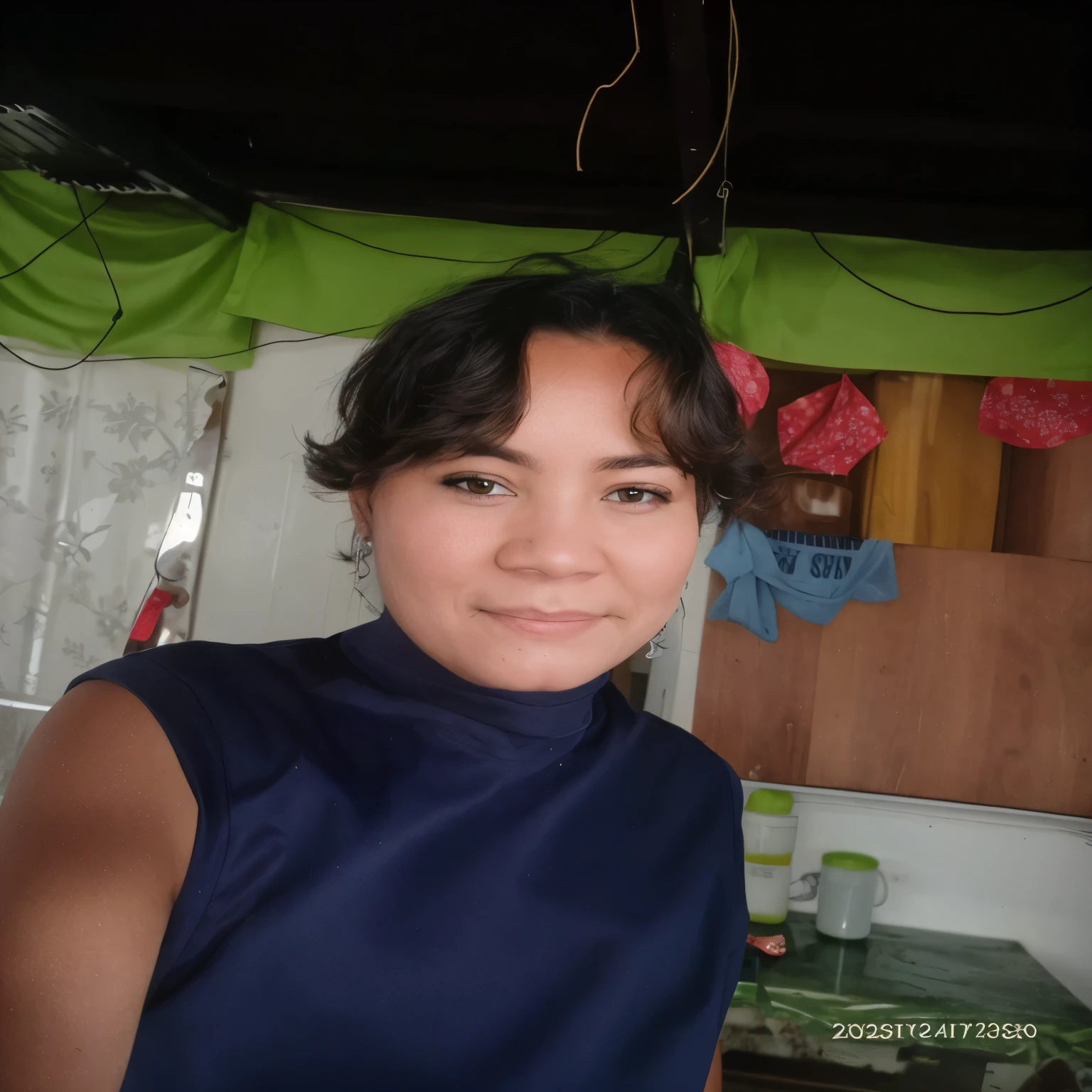 there is a woman that is standing in a kitchen with a blue shirt, 3 0 years old woman, 30 years old woman, with short hair, 3 0 years woman, in profile, 2 7 years old, 4 0 years old man, photo taken in 2 0 2 0, he is about 30 years old, he is about 3 0 years old