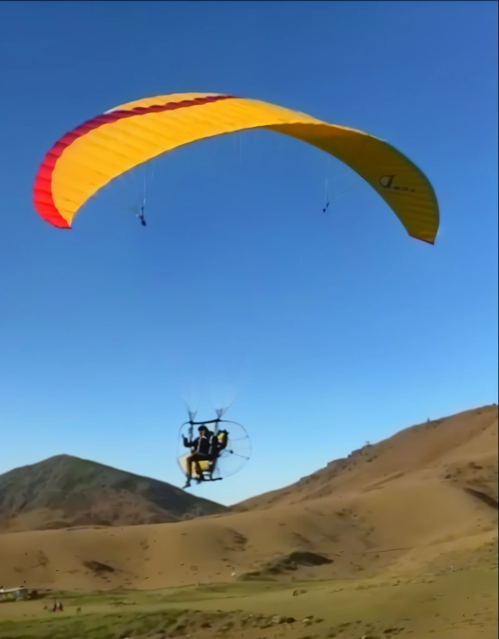 paraglider with engine and propeller with spiked rim protection in the air with yellow and red and blue parachute, puxando o movimento&#39;derp banshee&#39;, 4 0 9 6, flying towards the camera, brilhante, screenshot of youtube video, planar, aerial view, tiro voador, voando no ar, instagram post, riding in the sky, 2024, 2 Poster . Photography. , realistic and professional menu with chocolate tones colored , highest quality, ultra detail, illustration, beautiful detail, depth of field, dynamic angle, 8K wallpaper, realistic:1,(, best quality of light and shadow, 4k, 8K, CG, Fine details, blurred background, (extremely detailed wallpaper of the CG 8k unit), Lighting, poster of high-level. real:1.4 . Realistic:1.5
