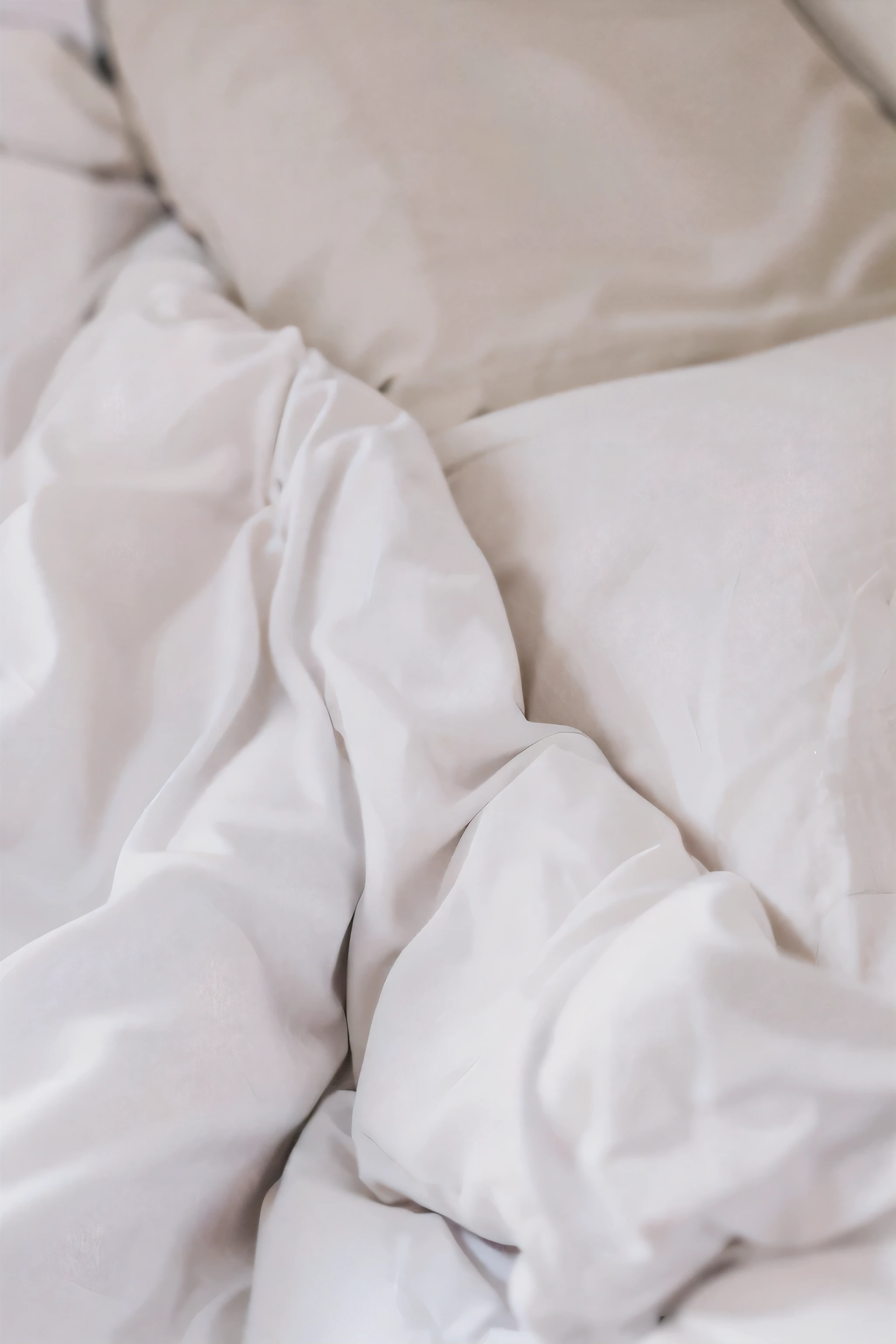 there is a white blanket and a white pillow on a ground, 白色ground单, white ground, messy ground, huddle under the quilt, lying in ground, laying in ground, un made ground, cozy ground, ground, ground is not made, white pillow, covered with blanket, stand up, mixed art, lying at the ground, someone in home sits in ground