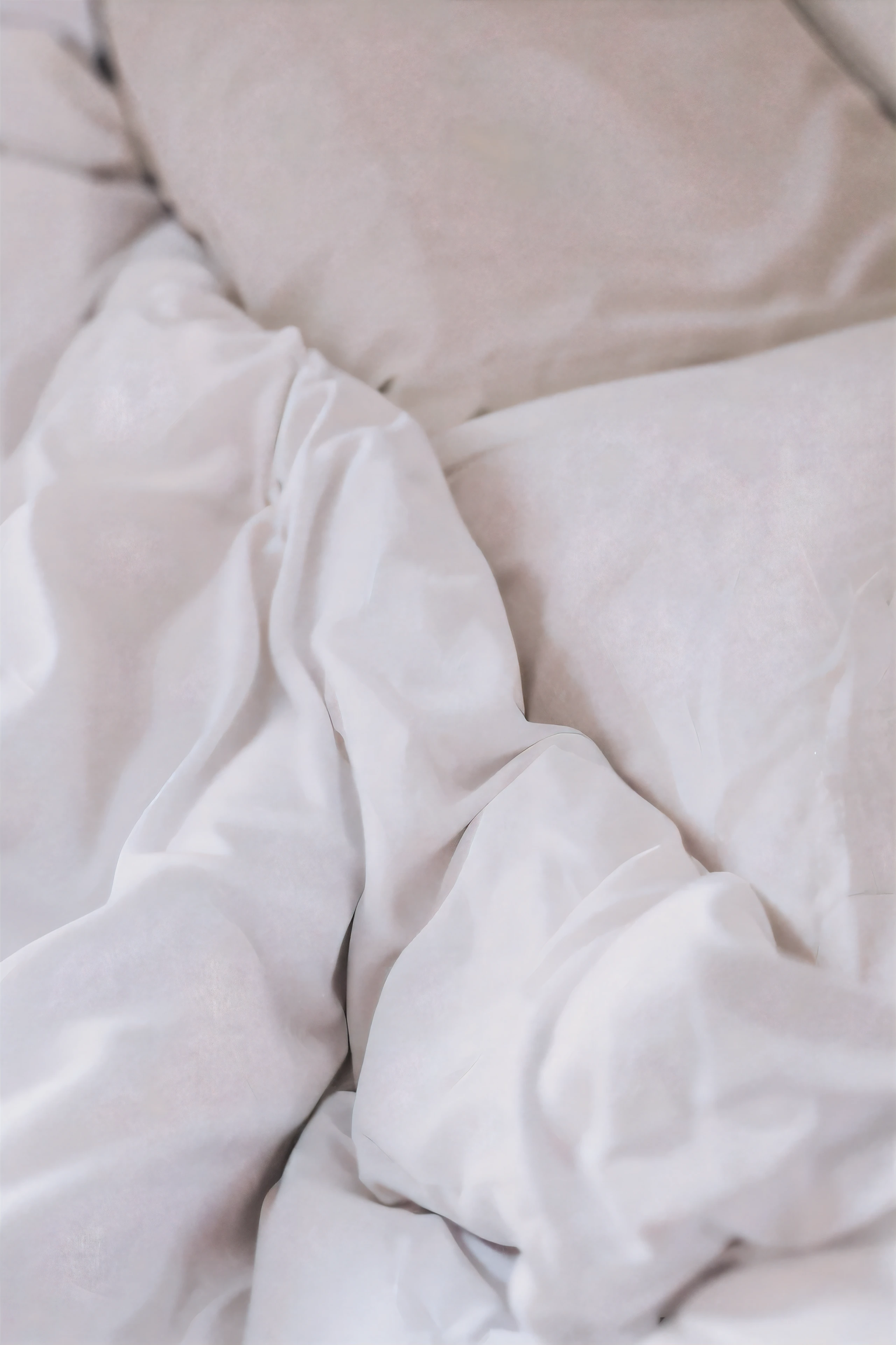 there is a white blanket and a white pillow on a ground, 白色ground单, white ground, messy ground, huddle under the quilt, lying in ground, laying in ground, un made ground, cozy ground, ground, ground is not made, white pillow, covered with blanket, stand up, mixed art, lying at the ground, someone in home sits in ground