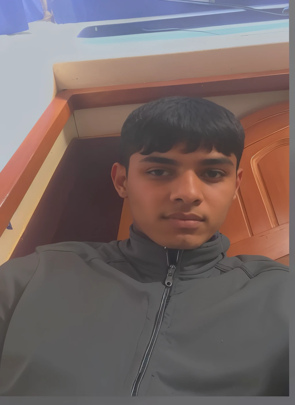 there is a man that is sitting in a chair with a cell phone, around 1 s old, 18 years old, riyahd cassiem, very very low quality picture, 1 6 year ismail, emad mostaque, 14 yo berber boy, mohamed chahin, reyyan, profile picture 1024px