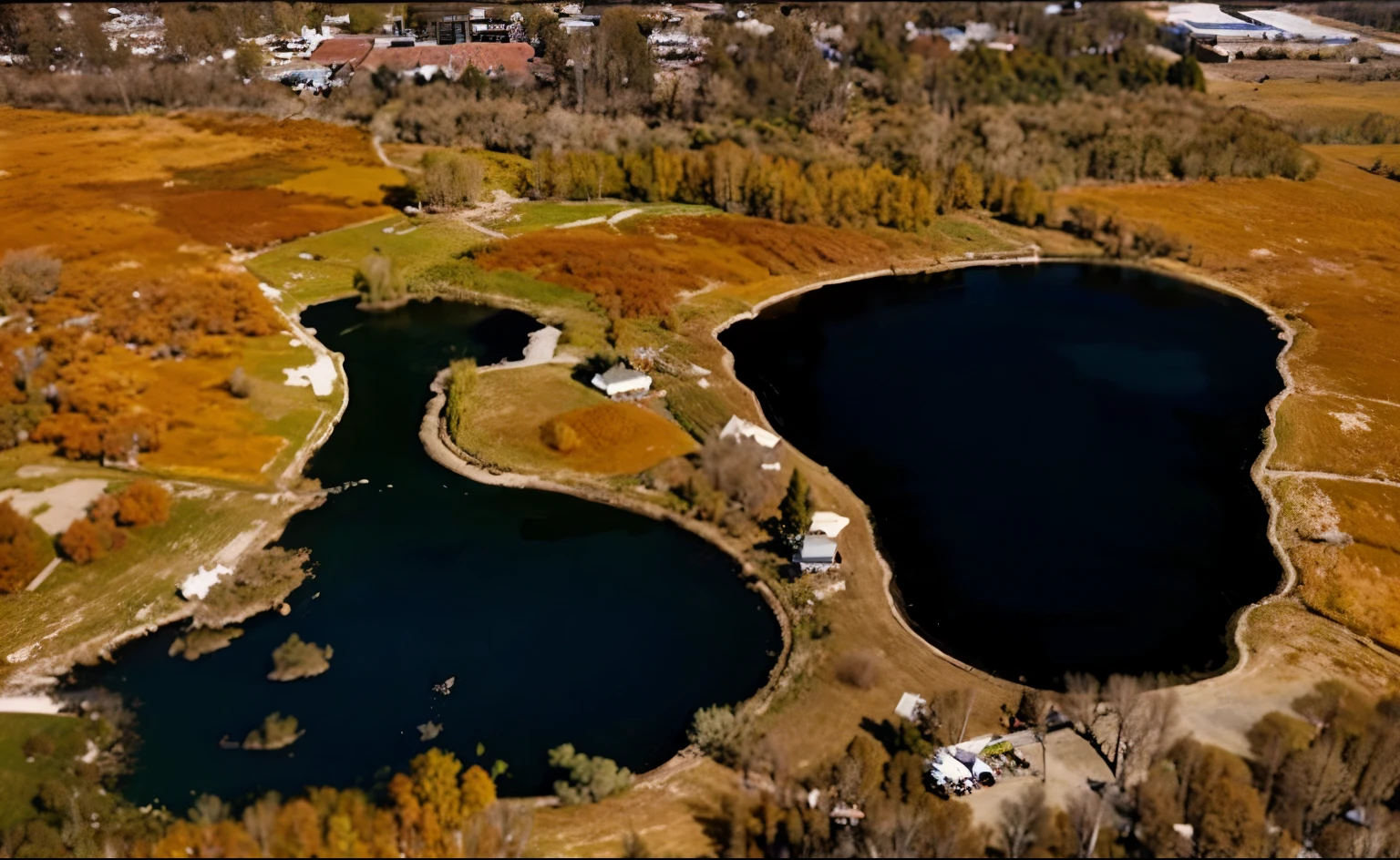 Please create an watercolor painting of the image, add green grass and tall trees surrounding both the lake, add a road in between both the lakes