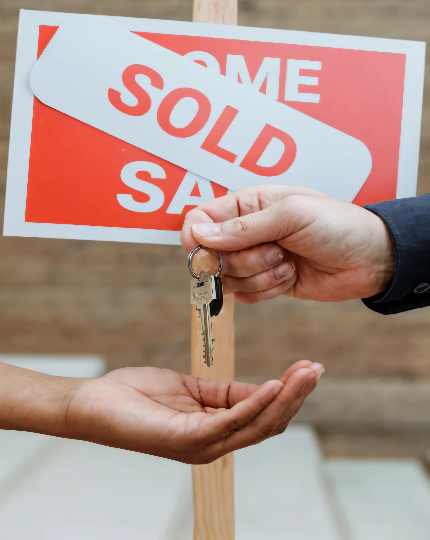 someone holding a sold sign and a key in their hand, selling insurance, an estate agent listing photo, closeup photograph, photograph credit: ap, sales, sold at an auction, sold for, photo shot, close-up photograph, close - up photograph, by James Warhola, pair of keys, candid photograph, stock image, photo - shot, uploaded