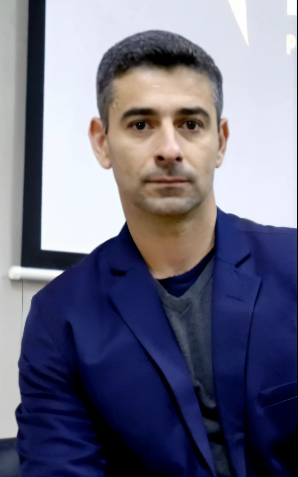 arafed man in a blue suit sitting in front of a projector screen, george doutsiopoulos, george patsouras, jamel shabbaz, baris yesilbas, christian dimitrov, jeremy lipkin, farid ghanbari, jeremy pitkin, edin durmisevic, encho enchev, ahmad merheb