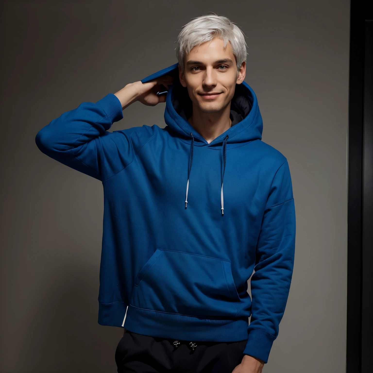 A slim, tall man with a relaxed smile and bright eyes. He wears a blue hoodie with a hood, black pants, and has short, white hair. His posture is relaxed, exuding calmness and confidence.