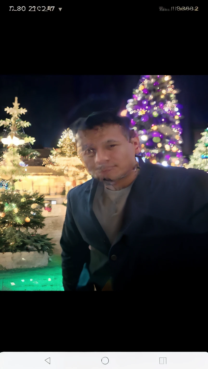 An arafe man wearing a blue shirt standing in front of a Christmas tree, hideki anno, Taken in the early 2020s, 2022 photos, profile photo, hideaki anno, Christian Orillo, profile image, Jose Miguel remains French, Inspired by Randy Vargas, David Villegas, Eloy Morales