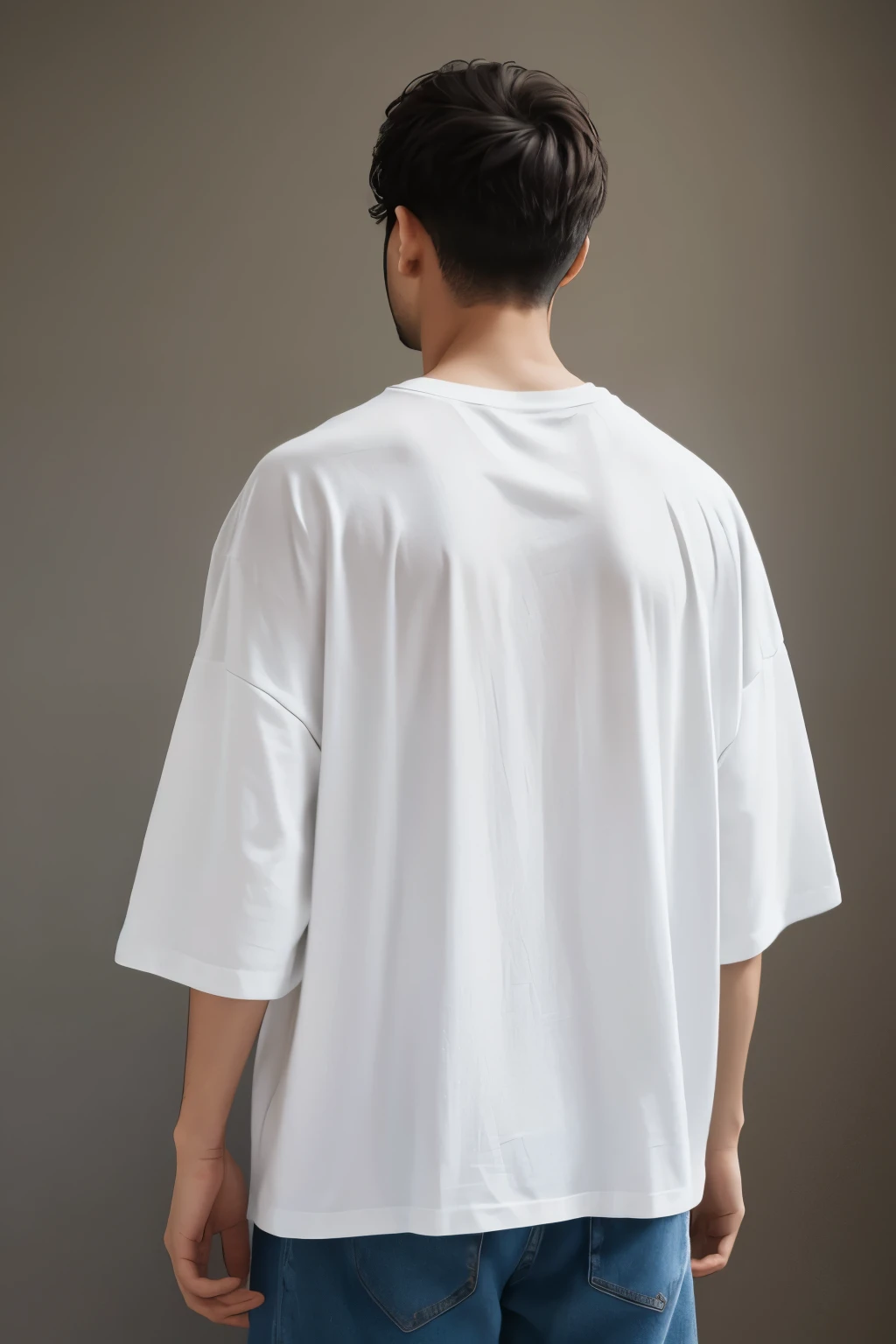 A man wearing a basic oversized white t-shirt with his back turned 

