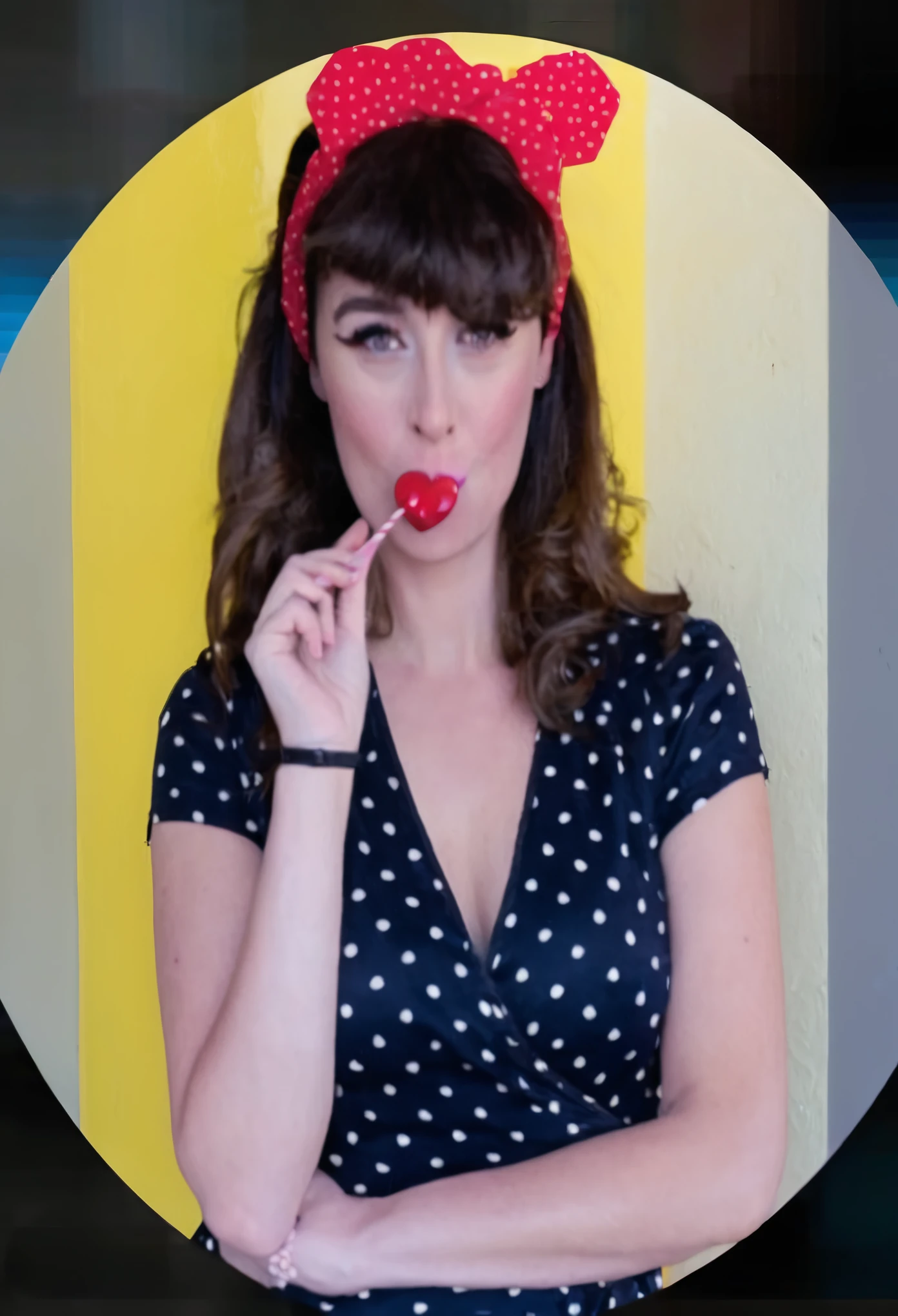 This woman without the lolly, wearing heart sunglasses, a vintage dress and sandals