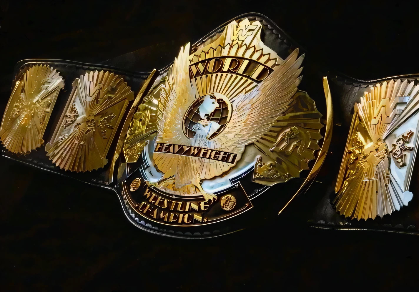 a close up of a gold belt with a black background, gold belt, big belt, huge belt, with an eagle emblem, masterpiece!!, closeup view, medium closeup, gold wings, detailed zoom photo, adonis belt, medium closeup shot, masterpiece!!!, phoenix warrior, !!award-winning!!, award - winning details, award-winning, award - winning