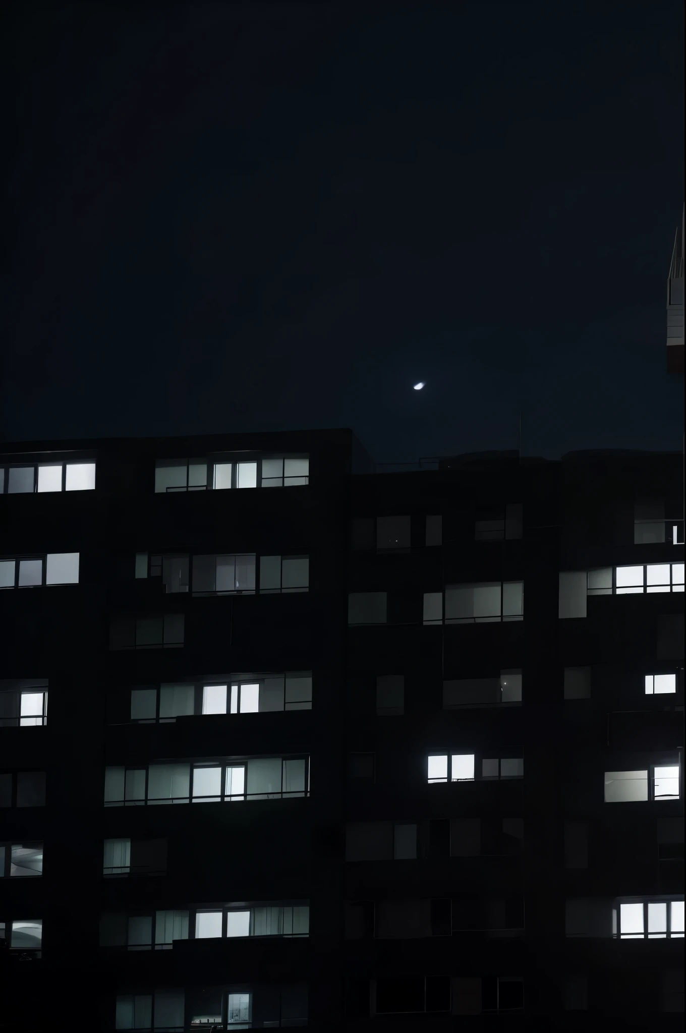A residential building,Only one window is lit,late night,clean sky,clean background