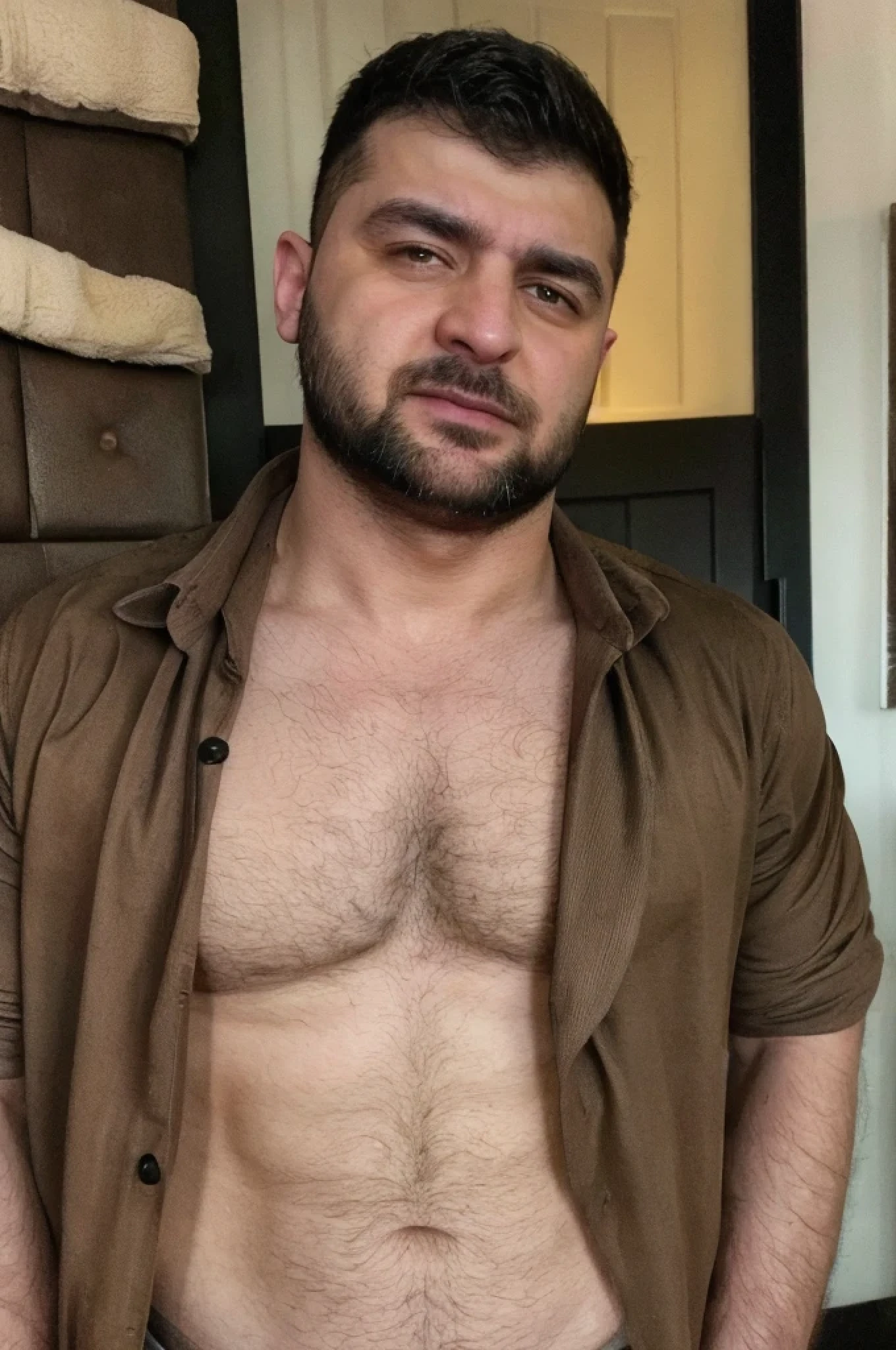 a kurdishoffice worker, thick eyebrows, cruffy beard, very very hairy chest, open shirt buttons, a peek to his manly hairy chest, work attire, many chest hair visible from the open shirt part, small cleavage opne shirt buttons, vey very hairy, extremely hairy torso, manly man, macho, excluding manliness, rough look,

