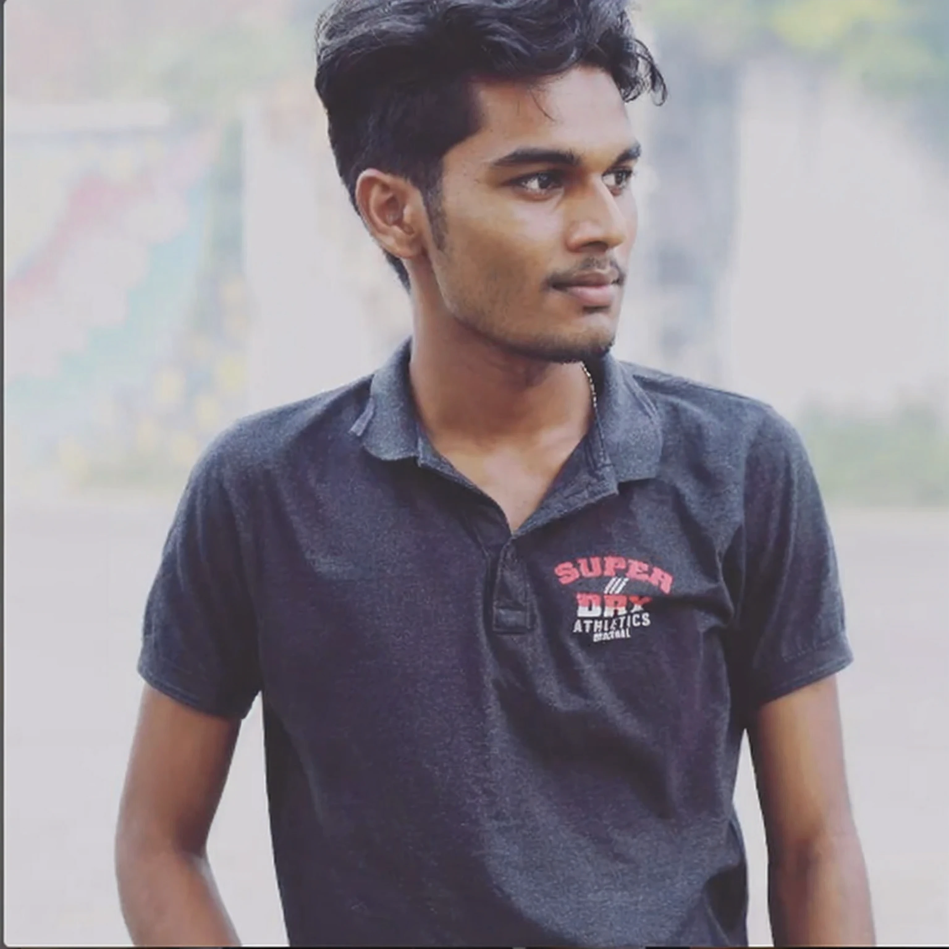 arafed man in a black shirt standing in a parking lot, jayison devadas, with accurate face, jayison devadas style, candid picture, candid photo, student, ayan nag, with lovely look, front profile!!!!, inspired by Odhise Paskali, indian, with a cool pose, without helmet, inspired by Saurabh Jethani